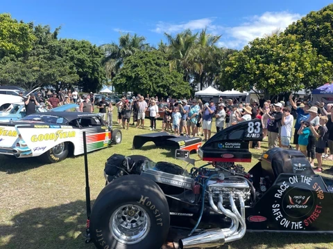 NitroVision dragster on display at a community event with crowds gathered